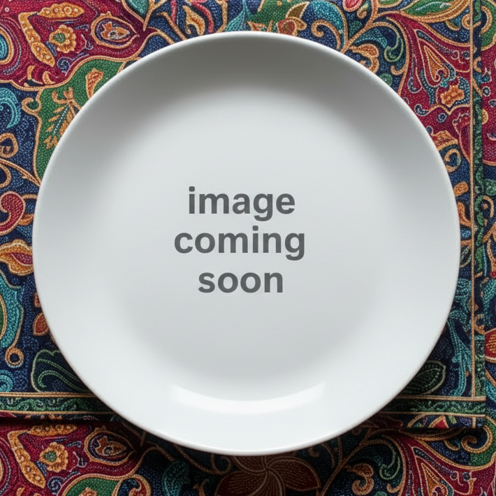 empty plate sitting on malaysian batik